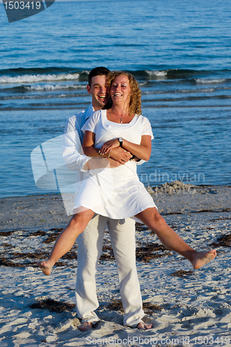 Image of Happy young couple at beach