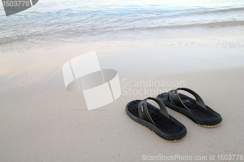 Image of flip flops on the beach