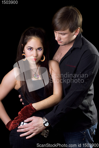 Image of Portrait of the young man and woman. Isolated on black