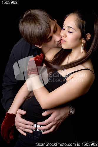 Image of Man kissing woman