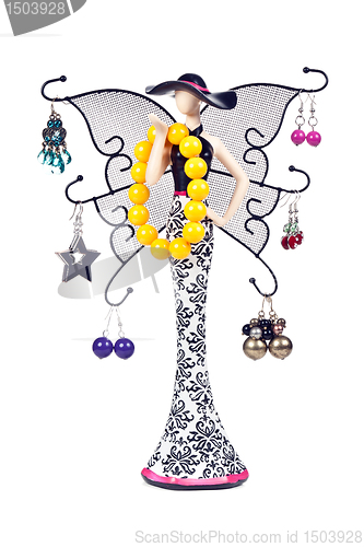 Image of statuette woman with wings hung with jeweled