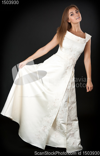 Image of beautiful young girl in a cream gown