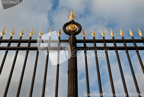 Image of steel fence with gold spears