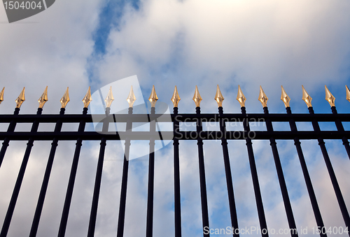 Image of steel fence with gold spears