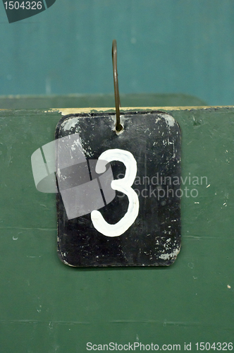Image of number tag, three
