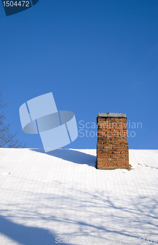 Image of Snowy roof and red brick chimney