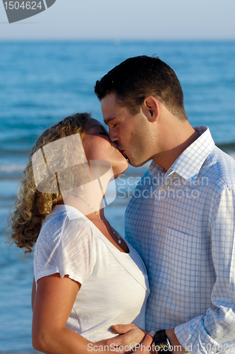Image of Young couple are kissing.