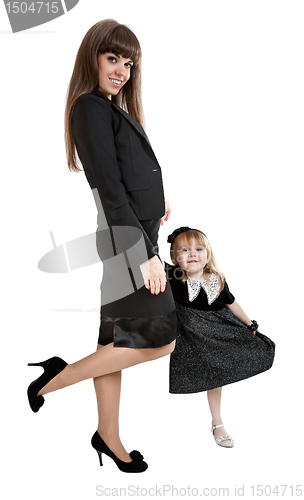 Image of Mother with little girl standing on one leg