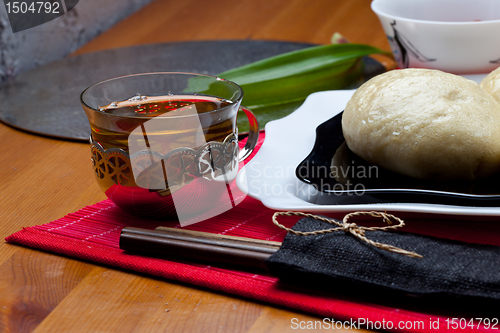 Image of red tea and korean cakes pyan-se