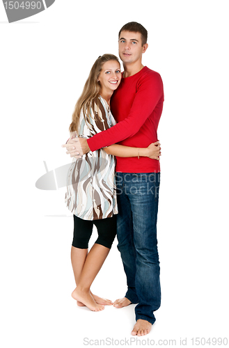 Image of girl hugging a guy in a red dress in the studio