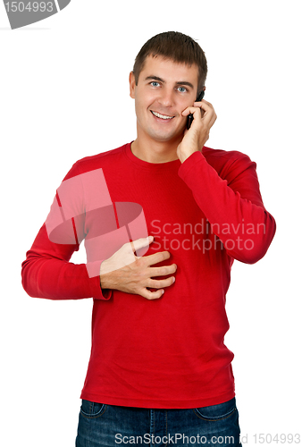 Image of man in a red dress speaks on a mobile phone.