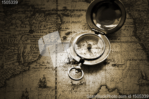 Image of old compass on vintage map 