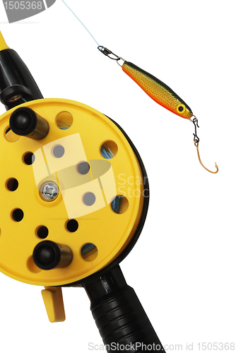 Image of fishing rod with yellow reel  