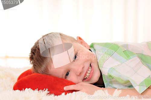 Image of child with a plush heart