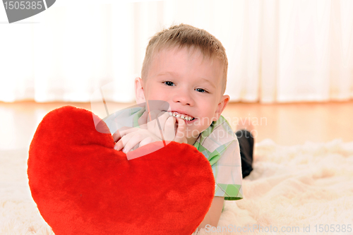 Image of child with a plush heart