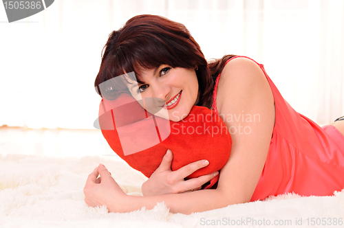 Image of woman with plush heart