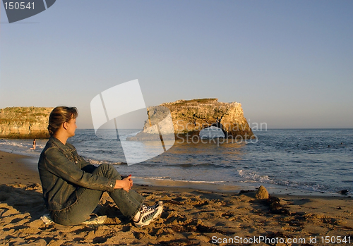 Image of Woman relaxing on the beach