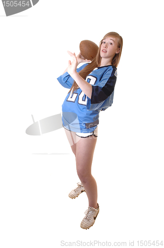 Image of Girl playing football.