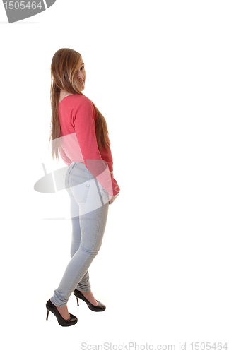 Image of Girl in jeans and sweater.