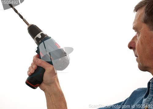 Image of Senior man holding a power drill