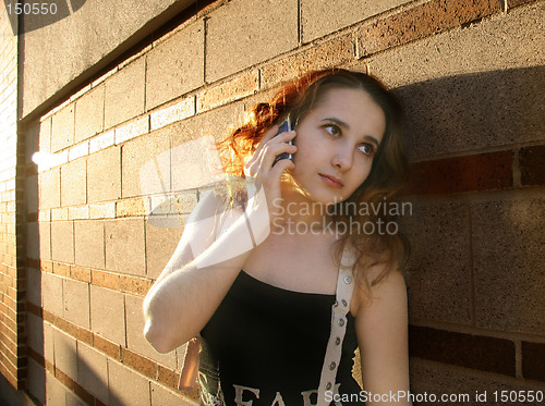 Image of Girl in a city at sunset