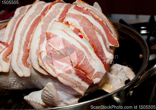 Image of Bacon laid on turkey for roasting