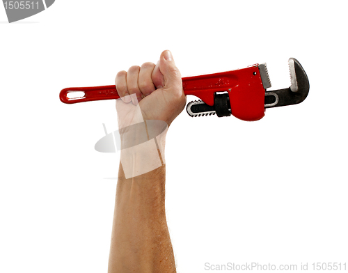 Image of Senior man holding a large wrench