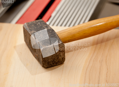 Image of Large lump hammer on workbench