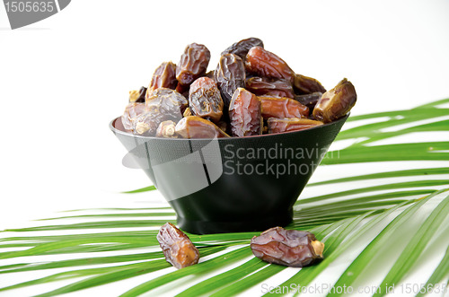 Image of Plate full of Dates Fruit isolated on white Background