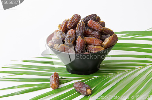 Image of Plate full of Dates Fruit isolated on white Background