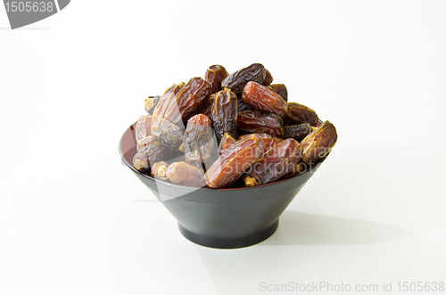 Image of Plate full of Dates Fruit isolated on white Background