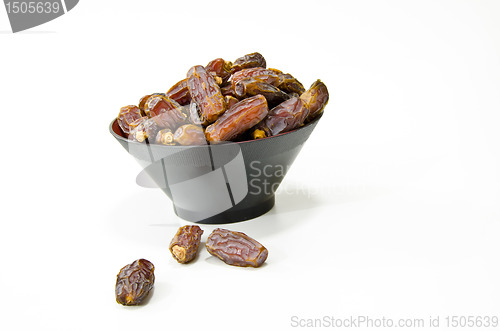 Image of Plate full of Dates Fruit isolated on white Background