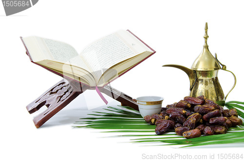 Image of Thge Holy Quran with Dates Fruit and Arabic Coffee Pot
