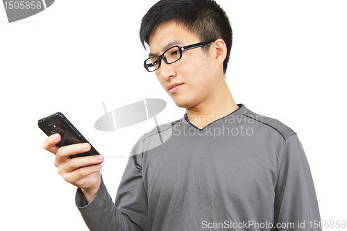 Image of man writting SMS on mobile phone