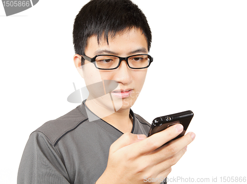 Image of man writting SMS on mobile phone