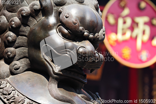 Image of Bronze lion in chinese temple