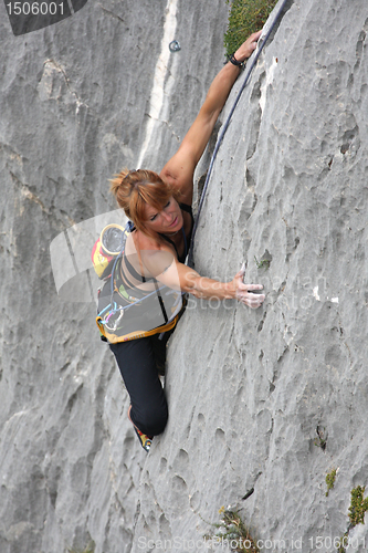 Image of Rock climber in a steep cliff