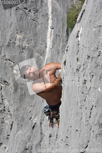 Image of Male rock climber looking up.