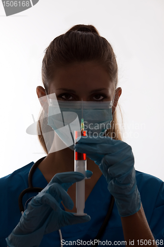 Image of silhouette of a nurse with syringe