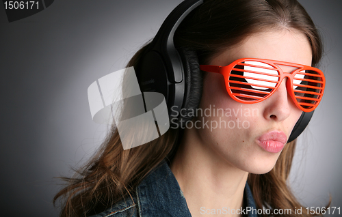 Image of splendid girl in headphones