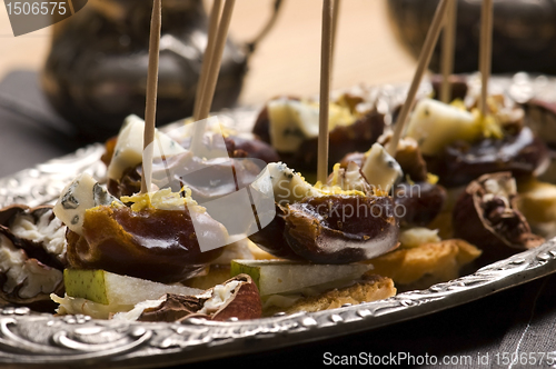 Image of Appetizer Plate with Dactyl, Pecan nuts and Cheese