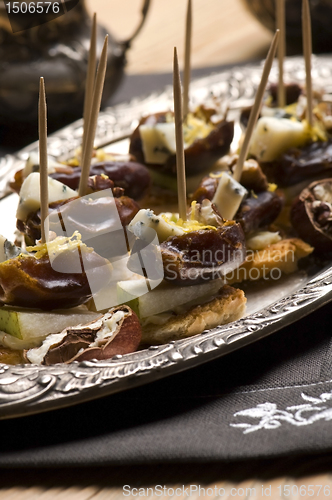 Image of Appetizer Plate with Dactyl, Pecan nuts and Cheese