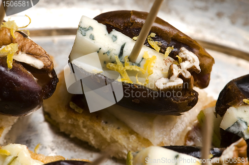 Image of Appetizer Plate with Dactyl, Pecan nuts and Cheese