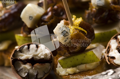 Image of Appetizer Plate with Dactyl, Pecan nuts and Cheese