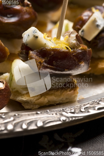 Image of Appetizer Plate with Dactyl, Pecan nuts and Cheese