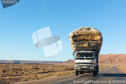 Image of overloaded truck on highway, morocco