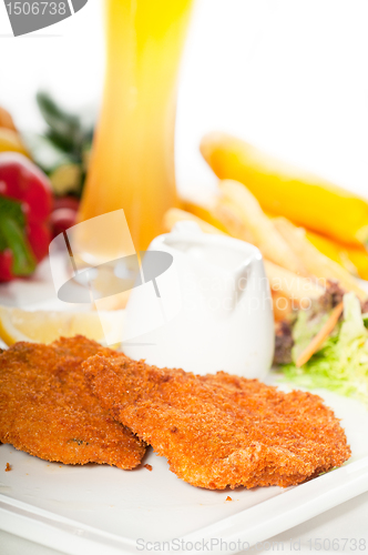 Image of classic Milanese veal cutlets and vegetables