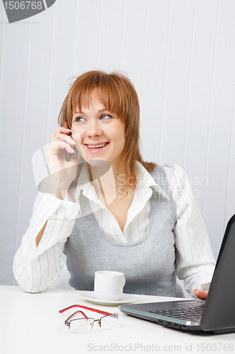 Image of Attractive girl talking on the phone