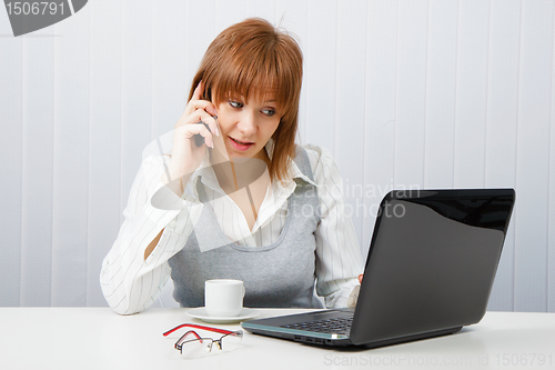 Image of Attractive girl talking on the phone