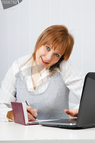 Image of Attractive happy girl. Office